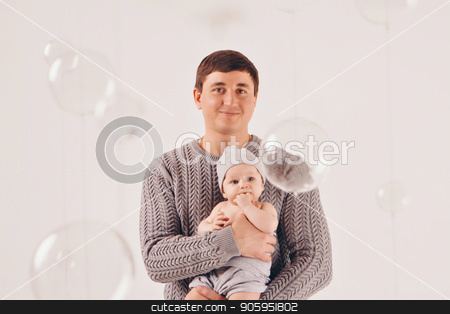 To use this stock image in your creative project, please select the size you need over to the right and click the "Add to Cart" button.
Your downloaded image will come with the Cutcaster watermark removed so don’t worry about the watermark you see on this page. portrait: happy dad holds a child in a knitted hat in his hands. Family in warm grey clothes on white background stock photo, portrait: happy dad holds a child in a knitted hat in his hands. Family in warm grey clothes on white background by aaalll3110