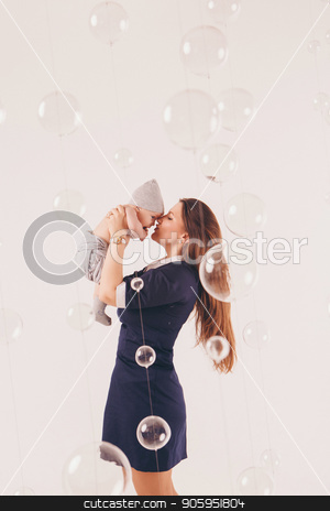 To use this stock image in your creative project, please select the size you need over to the right and click the "Add to Cart" button.
Your downloaded image will come with the Cutcaster watermark removed so don’t worry about the watermark you see on this page. the mother holds her son in her arms, leaning against his face. Family portrait: woman in blue dress on white background. Health care concept: healthy family stock photo, the mother holds her son in her arms, leaning against his face. Family portrait: woman in blue dress on white background. Health care concept: healthy family by aaalll3110