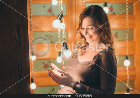 To use this stock image in your creative project, please select the size you need over to the right and click the "Add to Cart" button.
Your downloaded image will come with the Cutcaster watermark removed so don’t worry about the watermark you see on this page. a pregnant woman on a lamps background stock photo, a pregnant woman on a lamps background by aaalll3110