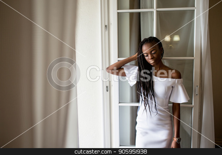 To use this stock image in your creative project, please select the size you need over to the right and click the "Add to Cart" button.
Your downloaded image will come with the Cutcaster watermark removed so don’t worry about the watermark you see on this page. Beautiful afroamerican girl with dreadlocks or african braids in long white dress standing near the french window. stock photo, Beautiful afroamerican girl with dreadlocks or african braids in long white dress standing near the french window. by Andrii Kobryn