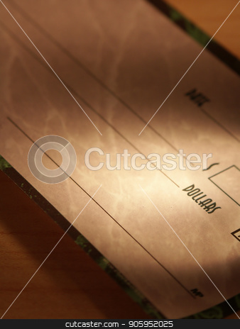To use this stock image in your creative project, please select the size you need over to the right and click the "Add to Cart" button.
Your downloaded image will come with the Cutcaster watermark removed so don’t worry about the watermark you see on this page. Dollar check book stock photo, Dollar check book on a table by Bruce Rolff