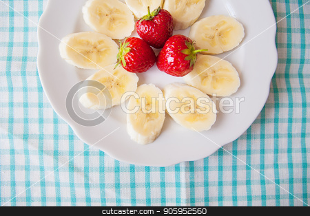 To use this stock image in your creative project, please select the size you need over to the right and click the "Add to Cart" button.
Your downloaded image will come with the Cutcaster watermark removed so don’t worry about the watermark you see on this page. banana and strawberries on a white plate and a colorful napkin stock photo, banana and strawberries on a white plate and a colorful napkin. by Sergiy Artsaba