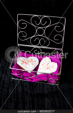 To use this stock image in your creative project, please select the size you need over to the right and click the "Add to Cart" button.
Your downloaded image will come with the Cutcaster watermark removed so don’t worry about the watermark you see on this page. Cookies in the form of heart lies in a casket with pink cloth stock photo, Cookies in the form of heart lies in a casket with pink cloth. by Sergiy Artsaba