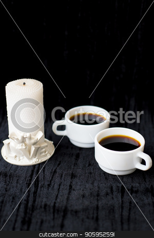 To use this stock image in your creative project, please select the size you need over to the right and click the "Add to Cart" button.
Your downloaded image will come with the Cutcaster watermark removed so don’t worry about the watermark you see on this page. candle and two cups of coffee on a black background stock photo, candle and two cups of coffee on a black background. by Sergiy Artsaba