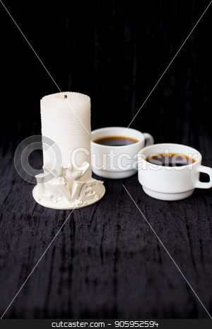 To use this stock image in your creative project, please select the size you need over to the right and click the "Add to Cart" button.
Your downloaded image will come with the Cutcaster watermark removed so don’t worry about the watermark you see on this page. candle and two cups of coffee on a black background stock photo, candle and two cups of coffee on a black background. by Sergiy Artsaba