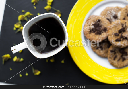 To use this stock image in your creative project, please select the size you need over to the right and click the "Add to Cart" button.
Your downloaded image will come with the Cutcaster watermark removed so don’t worry about the watermark you see on this page. Oatmeal cookies with chocolate on bright yellow plate and cup of coffee stock photo, Oatmeal cookies with chocolate on bright yellow plate and cup of coffee. by Sergiy Artsaba