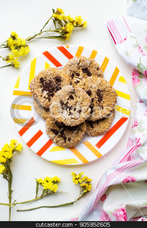 To use this stock image in your creative project, please select the size you need over to the right and click the "Add to Cart" button.
Your downloaded image will come with the Cutcaster watermark removed so don’t worry about the watermark you see on this page. Oatmeal cookies with chocolate on a plate with bright cloth and flowers stock photo, Oatmeal cookies with chocolate on a plate with bright cloth and flowers. by Sergiy Artsaba