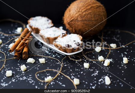 To use this stock image in your creative project, please select the size you need over to the right and click the "Add to Cart" button.
Your downloaded image will come with the Cutcaster watermark removed so don’t worry about the watermark you see on this page. coconut muffins on a black background stock photo, coconut muffins on a black background with cinnamon sticks and whole coconut slices and candied by Sergiy Artsaba