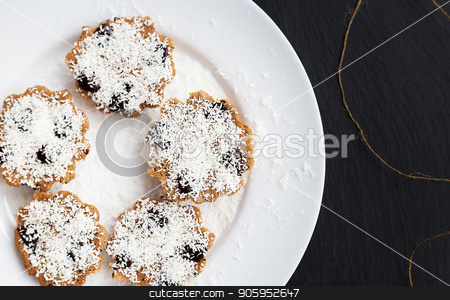To use this stock image in your creative project, please select the size you need over to the right and click the "Add to Cart" button.
Your downloaded image will come with the Cutcaster watermark removed so don’t worry about the watermark you see on this page. sweet coconut muffins on a white plate on a black board. stock photo, sweet coconut muffins on a white plate on a black board by Sergiy Artsaba