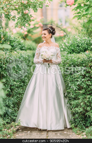 To use this stock image in your creative project, please select the size you need over to the right and click the "Add to Cart" button.
Your downloaded image will come with the Cutcaster watermark removed so don’t worry about the watermark you see on this page. Full-length photo of the bride looking aside while spending time in the garden. stock photo, Full-length photo of the bride looking aside while spending time in the garden by Andrii Kobryn