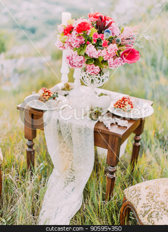 To use this stock image in your creative project, please select the size you need over to the right and click the "Add to Cart" button.
Your downloaded image will come with the Cutcaster watermark removed so don’t worry about the watermark you see on this page. The wedding table set covered with cake, colourful peonies and candles among the mountains. stock photo, The wedding table set covered with cake, colourful peonies and candles among the mountains by Andrii Kobryn