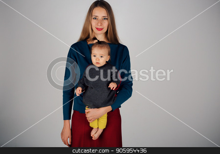 To use this stock image in your creative project, please select the size you need over to the right and click the "Add to Cart" button.
Your downloaded image will come with the Cutcaster watermark removed so don’t worry about the watermark you see on this page. family photo: a woman holding a child in her arms. Fashion for the whole family: mother and daughter dressed in yellow, gray, red. Model shows clothes stock photo, family photo: a woman holding a child in her arms. Fashion for the whole family: mother and daughter dressed in yellow-gray. Model shows clothes by aaalll3110