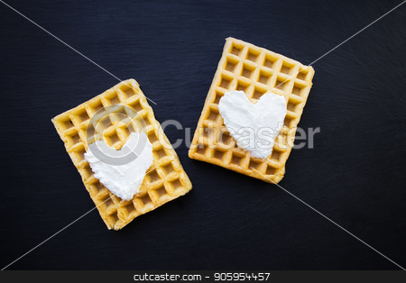 To use this stock image in your creative project, please select the size you need over to the right and click the "Add to Cart" button.
Your downloaded image will come with the Cutcaster watermark removed so don’t worry about the watermark you see on this page. Delicious belgian waffles with cream on a black background. stock photo, Delicious belgian waffles with cream on a black background by Sergiy Artsaba