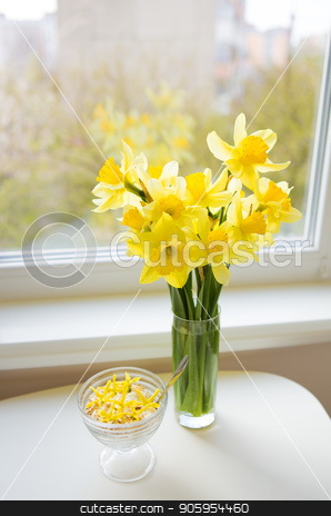 To use this stock image in your creative project, please select the size you need over to the right and click the "Add to Cart" button.
Your downloaded image will come with the Cutcaster watermark removed so don’t worry about the watermark you see on this page. Posy of bright yellow daffodils on white wooden table. stock photo, Posy of bright yellow daffodils on white wooden table by Sergiy Artsaba