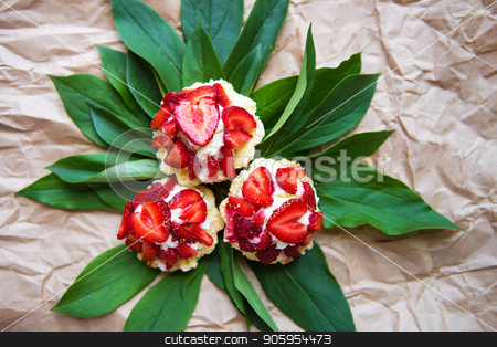 To use this stock image in your creative project, please select the size you need over to the right and click the "Add to Cart" button.
Your downloaded image will come with the Cutcaster watermark removed so don’t worry about the watermark you see on this page. Beautiful and bright cupcakes with strawberries lie on green leaves, close-up stock photo, Beautiful and bright cupcakes with strawberries lie on green leaves, close-up. by Sergiy Artsaba