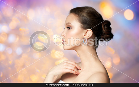 To use this stock image in your creative project, please select the size you need over to the right and click the "Add to Cart" button.
Your downloaded image will come with the Cutcaster watermark removed so don’t worry about the watermark you see on this page. close up of beautiful woman face with earring stock photo, beauty, jewelry, people and luxury concept - close up of beautiful asian woman face with earring over holidays lights background by Syda Productions