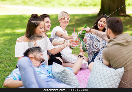 To use this stock image in your creative project, please select the size you need over to the right and click the "Add to Cart" button.
Your downloaded image will come with the Cutcaster watermark removed so don’t worry about the watermark you see on this page. friends clinking drinks at picnic in summer park stock photo, leisure, people and celebration concept - happy friends clinking non alcoholic drinks at picnic in summer park by Syda Productions