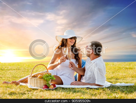 To use this stock image in your creative project, please select the size you need over to the right and click the "Add to Cart" button.
Your downloaded image will come with the Cutcaster watermark removed so don’t worry about the watermark you see on this page. smiling couple drinking champagne at picnic stock photo, love, dating, people and celebration concept - smiling couple drinking champagne at picnic on meadow over sunset sky background by Syda Productions