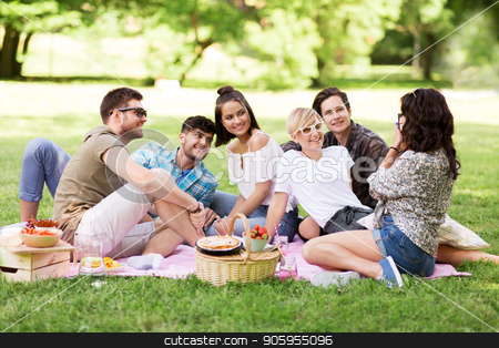 To use this stock image in your creative project, please select the size you need over to the right and click the "Add to Cart" button.
Your downloaded image will come with the Cutcaster watermark removed so don’t worry about the watermark you see on this page. friends photographing at picnic in summer park stock photo, friendship, leisure and technology concept - group of happy smiling friends photographing at picnic in summer park by Syda Productions