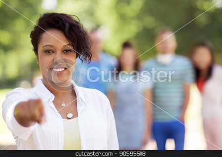 To use this stock image in your creative project, please select the size you need over to the right and click the "Add to Cart" button.
Your downloaded image will come with the Cutcaster watermark removed so don’t worry about the watermark you see on this page. group of happy international friends outdoors stock photo, people, friendship and international concept - happy smiling woman pointing at you and group of happy friends outdoors by Syda Productions