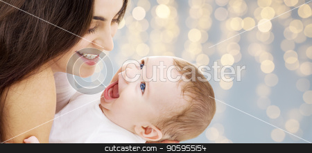To use this stock image in your creative project, please select the size you need over to the right and click the "Add to Cart" button.
Your downloaded image will come with the Cutcaster watermark removed so don’t worry about the watermark you see on this page. mother with baby over festive lights background stock photo, family and motherhood concept - happy smiling young mother with little baby over festive lights background by Syda Productions