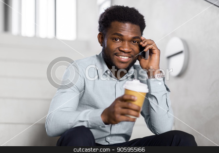 To use this stock image in your creative project, please select the size you need over to the right and click the "Add to Cart" button.
Your downloaded image will come with the Cutcaster watermark removed so don’t worry about the watermark you see on this page. businessman calling on smartphone at office stairs stock photo, business, technology, communication and people concept - african american businessman calling on smartphone and drinking coffee at office stairs by Syda Productions