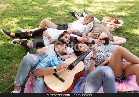 To use this stock image in your creative project, please select the size you need over to the right and click the "Add to Cart" button.
Your downloaded image will come with the Cutcaster watermark removed so don’t worry about the watermark you see on this page. friends with guitar chilling on picnic blanket stock photo, friendship, leisure and summer concept - group of happy smiling friends with guitar chilling on picnic blanket by Syda Productions