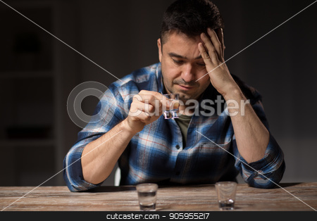 To use this stock image in your creative project, please select the size you need over to the right and click the "Add to Cart" button.
Your downloaded image will come with the Cutcaster watermark removed so don’t worry about the watermark you see on this page. man drinking alcohol at night stock photo, alcoholism, alcohol addiction and people concept - male alcoholic drinking shot at night by Syda Productions