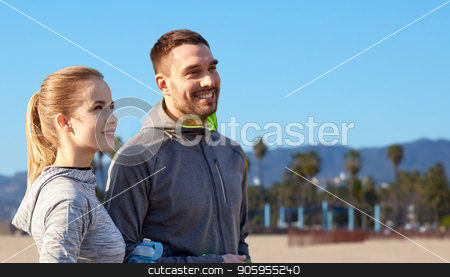 To use this stock image in your creative project, please select the size you need over to the right and click the "Add to Cart" button.
Your downloaded image will come with the Cutcaster watermark removed so don’t worry about the watermark you see on this page. couple of sportsmen with water over venice beach stock photo, fitness, sport and people concept - smiling couple with bottles of water over venice beach background in california by Syda Productions