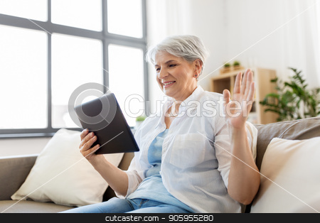 To use this stock image in your creative project, please select the size you need over to the right and click the "Add to Cart" button.
Your downloaded image will come with the Cutcaster watermark removed so don’t worry about the watermark you see on this page. senior woman having video chat on tablet pc stock photo, technology, people and communication concept - happy senior woman with tablet pc computer having video chat at home by Syda Productions