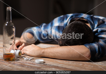 To use this stock image in your creative project, please select the size you need over to the right and click the "Add to Cart" button.
Your downloaded image will come with the Cutcaster watermark removed so don’t worry about the watermark you see on this page. dead man overdosed on pills with alcohol stock photo, suicide, depression and overdose concept - dead man with bottle of alcohol and pills lying on table at night by Syda Productions