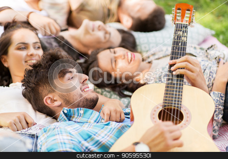 To use this stock image in your creative project, please select the size you need over to the right and click the "Add to Cart" button.
Your downloaded image will come with the Cutcaster watermark removed so don’t worry about the watermark you see on this page. friends playing guitar and chilling on blanket stock photo, friendship, leisure and summer concept - group of happy smiling friends playing guitar and chilling on picnic blanket by Syda Productions