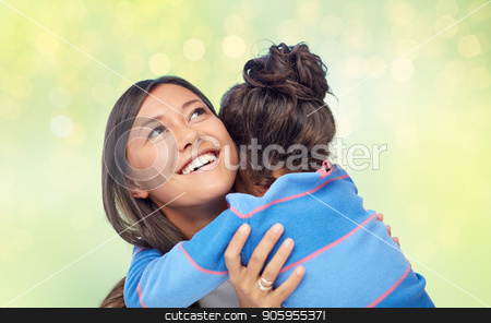 To use this stock image in your creative project, please select the size you need over to the right and click the "Add to Cart" button.
Your downloaded image will come with the Cutcaster watermark removed so don’t worry about the watermark you see on this page. happy mother and daughter hugging over green stock photo, family, motherhood and people concept - happy mother and daughter hugging over green holidays lights background by Syda Productions