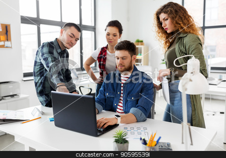To use this stock image in your creative project, please select the size you need over to the right and click the "Add to Cart" button.
Your downloaded image will come with the Cutcaster watermark removed so don’t worry about the watermark you see on this page. creative team working on user interface at office stock photo, business, technology and people concept - creative team or designers with laptop computer working on user interface at office by Syda Productions
