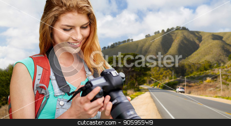 To use this stock image in your creative project, please select the size you need over to the right and click the "Add to Cart" button.
Your downloaded image will come with the Cutcaster watermark removed so don’t worry about the watermark you see on this page. woman with backpack and camera over big sur hills stock photo, travel, tourism and photography concept - happy young woman with backpack and camera photographing over big sur hills of california background by Syda Productions