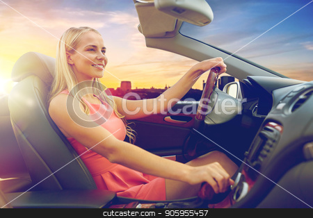 To use this stock image in your creative project, please select the size you need over to the right and click the "Add to Cart" button.
Your downloaded image will come with the Cutcaster watermark removed so don’t worry about the watermark you see on this page. woman driving convertible car over city sunset stock photo, travel, road trip and people concept - happy young woman driving convertible car over city sunset background by Syda Productions