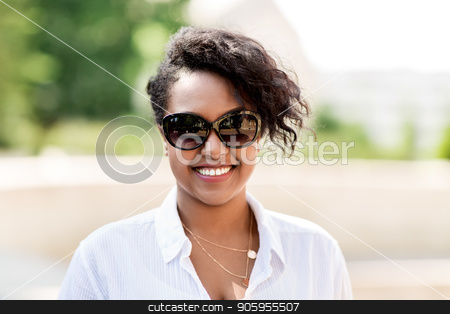 To use this stock image in your creative project, please select the size you need over to the right and click the "Add to Cart" button.
Your downloaded image will come with the Cutcaster watermark removed so don’t worry about the watermark you see on this page. happy african american young woman in sunglasses stock photo, people, summer and eyewear - happy african american young woman in sunglasses outdoors by Syda Productions