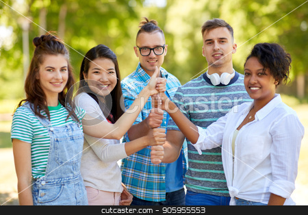 To use this stock image in your creative project, please select the size you need over to the right and click the "Add to Cart" button.
Your downloaded image will come with the Cutcaster watermark removed so don’t worry about the watermark you see on this page. happy friends making thumbs up gesture in park stock photo, success, friendship and international concept - group of happy smiling friends making thumbs up gesture in park by Syda Productions