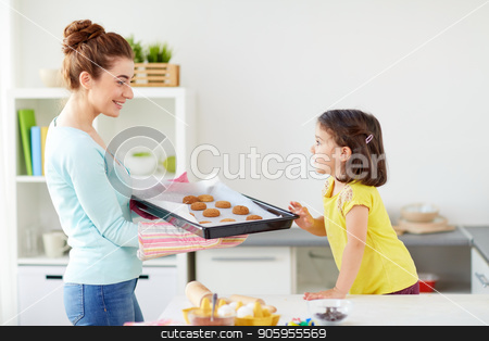 To use this stock image in your creative project, please select the size you need over to the right and click the "Add to Cart" button.
Your downloaded image will come with the Cutcaster watermark removed so don’t worry about the watermark you see on this page. happy mother and daughter baking cookies at home stock photo, family, cooking and people concept - happy mother holding tray of cookies and little daughter at home kitchen by Syda Productions