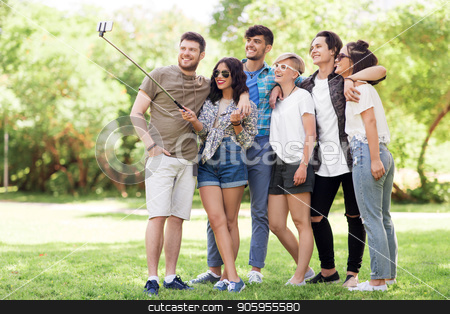 To use this stock image in your creative project, please select the size you need over to the right and click the "Add to Cart" button.
Your downloaded image will come with the Cutcaster watermark removed so don’t worry about the watermark you see on this page. friends taking picture by selfie stick at summer stock photo, friendship, leisure and technology concept - group of happy smiling friends taking picture by selfie stick at summer park by Syda Productions