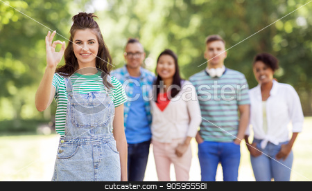 To use this stock image in your creative project, please select the size you need over to the right and click the "Add to Cart" button.
Your downloaded image will come with the Cutcaster watermark removed so don’t worry about the watermark you see on this page. group of happy international friends outdoors stock photo, people, friendship and international concept - happy smiling woman showing ok hand sign and group of happy friends outdoors by Syda Productions