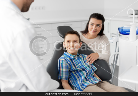 To use this stock image in your creative project, please select the size you need over to the right and click the "Add to Cart" button.
Your downloaded image will come with the Cutcaster watermark removed so don’t worry about the watermark you see on this page. mother and son visiting dentist at dental clinic stock photo, medicine, dentistry and healthcare concept - mother and son visiting dentist at dental clinic by Syda Productions