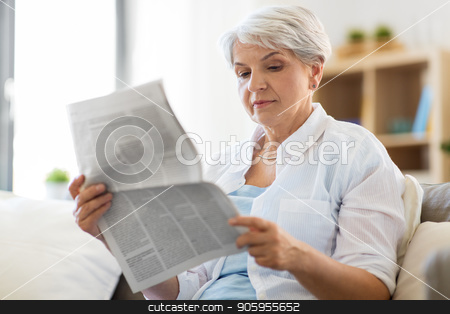 To use this stock image in your creative project, please select the size you need over to the right and click the "Add to Cart" button.
Your downloaded image will come with the Cutcaster watermark removed so don’t worry about the watermark you see on this page. senior woman reading newspaper at home stock photo, age and people concept - senior woman reading newspaper at home by Syda Productions