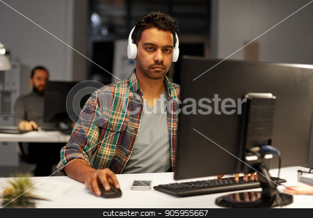 To use this stock image in your creative project, please select the size you need over to the right and click the "Add to Cart" button.
Your downloaded image will come with the Cutcaster watermark removed so don’t worry about the watermark you see on this page. creative man with headphones working at office stock photo, deadline, technology and people concept - creative man with headphones and computer listening to music and working at night office by Syda Productions
