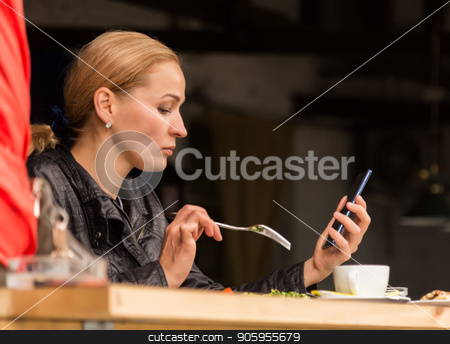 To use this stock image in your creative project, please select the size you need over to the right and click the "Add to Cart" button.
Your downloaded image will come with the Cutcaster watermark removed so don’t worry about the watermark you see on this page. businesswoman eating salad in an outdoor cafe. Healthy lifestyle: girl eating green tasty food and checks email on your phone stock photo, businesswoman eating salad in an outdoor cafe. Healthy lifestyle: girl eating green tasty food by Alexander