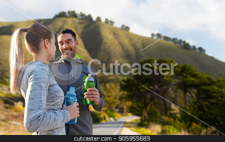 To use this stock image in your creative project, please select the size you need over to the right and click the "Add to Cart" button.
Your downloaded image will come with the Cutcaster watermark removed so don’t worry about the watermark you see on this page. couple of sportsmen with water over big sur hills stock photo, fitness, sport and people concept - smiling couple with bottles of water over big sur hills background in california by Syda Productions