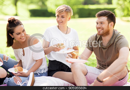 To use this stock image in your creative project, please select the size you need over to the right and click the "Add to Cart" button.
Your downloaded image will come with the Cutcaster watermark removed so don’t worry about the watermark you see on this page. happy friends eating sandwiches at summer picnic stock photo, friendship, leisure and fast food concept - group of happy friends eating sandwiches or burgers at picnic in summer park by Syda Productions