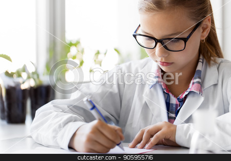 To use this stock image in your creative project, please select the size you need over to the right and click the "Add to Cart" button.
Your downloaded image will come with the Cutcaster watermark removed so don’t worry about the watermark you see on this page. girl studying chemistry at school laboratory stock photo, education, science and children concept - close up of girl studying chemistry at school laboratory and writing to workbook by Syda Productions