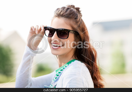 To use this stock image in your creative project, please select the size you need over to the right and click the "Add to Cart" button.
Your downloaded image will come with the Cutcaster watermark removed so don’t worry about the watermark you see on this page. portrait of young woman in sunglasses outdoors stock photo, summer, eyewear and people concept - portrait of happy smiling young woman or teenage girl in sunglasses outdoors by Syda Productions