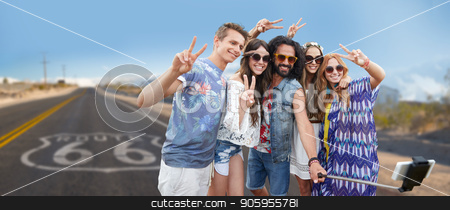 To use this stock image in your creative project, please select the size you need over to the right and click the "Add to Cart" button.
Your downloaded image will come with the Cutcaster watermark removed so don’t worry about the watermark you see on this page. hippie friends taking selfie over us route 66 stock photo, travel, technology and road trip concept - smiling young hippie friends taking picture by smartphone on selfie stick and showing peace hand sign over us route 66 background by Syda Productions